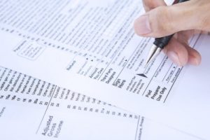 trump tax plan, person filling out tax forms